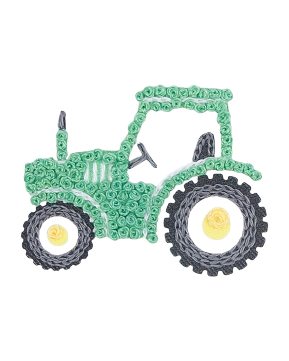 Green toy tractor made of interlocking bricks on a white background