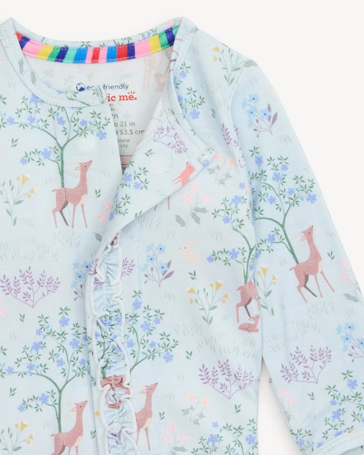 Children's outfit with deer and floral pattern on a light blue background