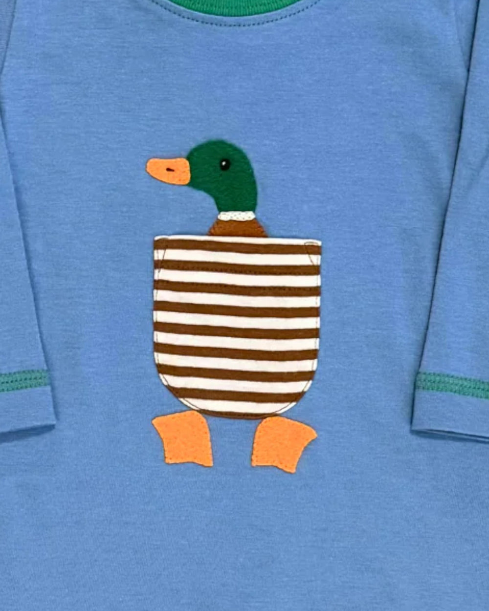 Blue shirt with a duck appliqué featuring a striped body and orange feet.