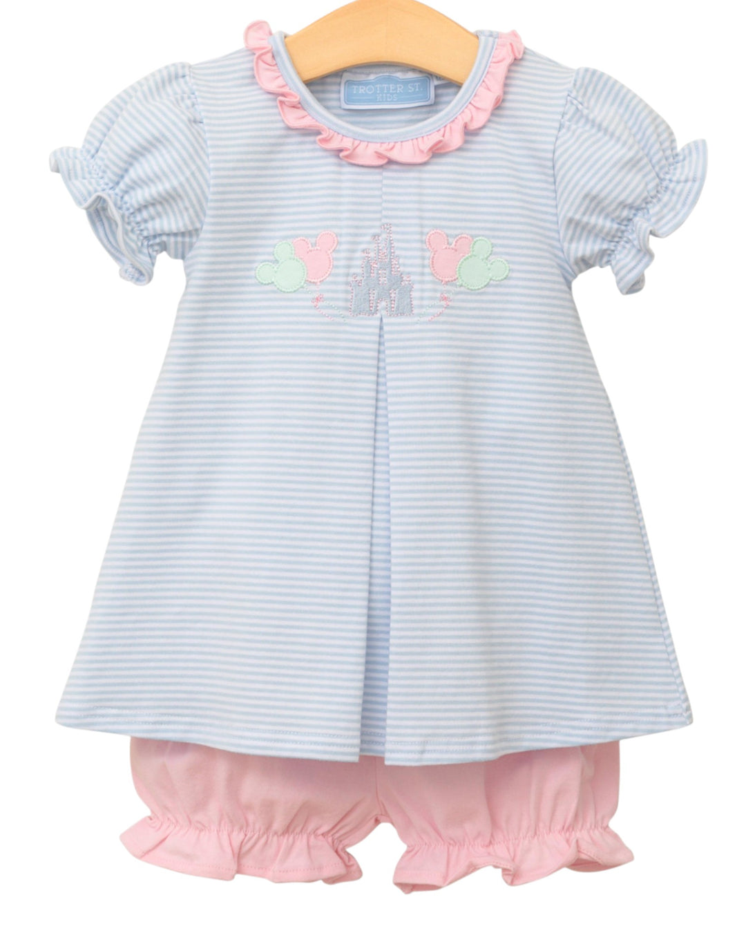 Baby dress with ruffled sleeves and pink bloomers on a white background