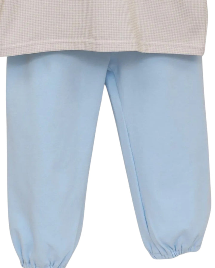 Light blue pants with elastic cuffs, shown from the waist down on a white background, that store