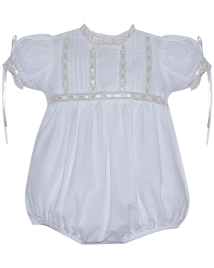 White baby romper with lace details on a white background
