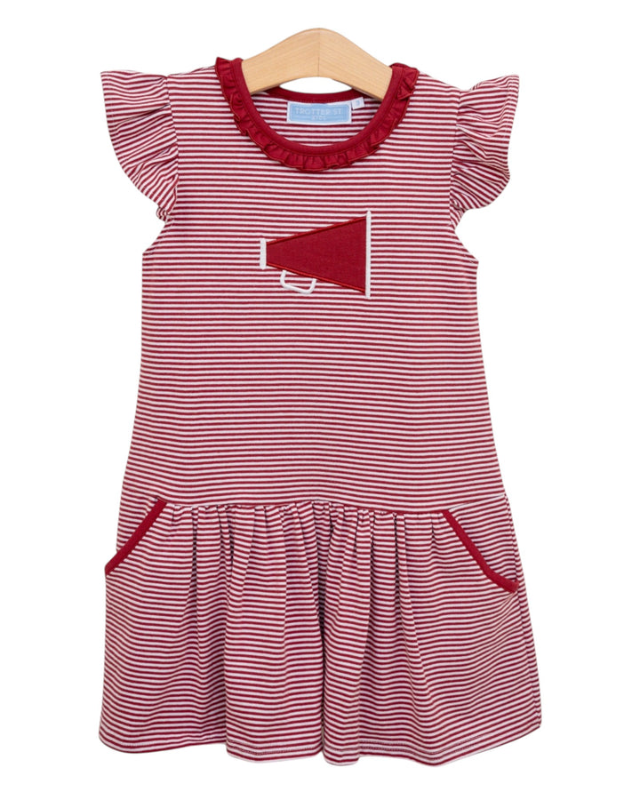Red and white striped dress with a pocket on a hanger against a white background
