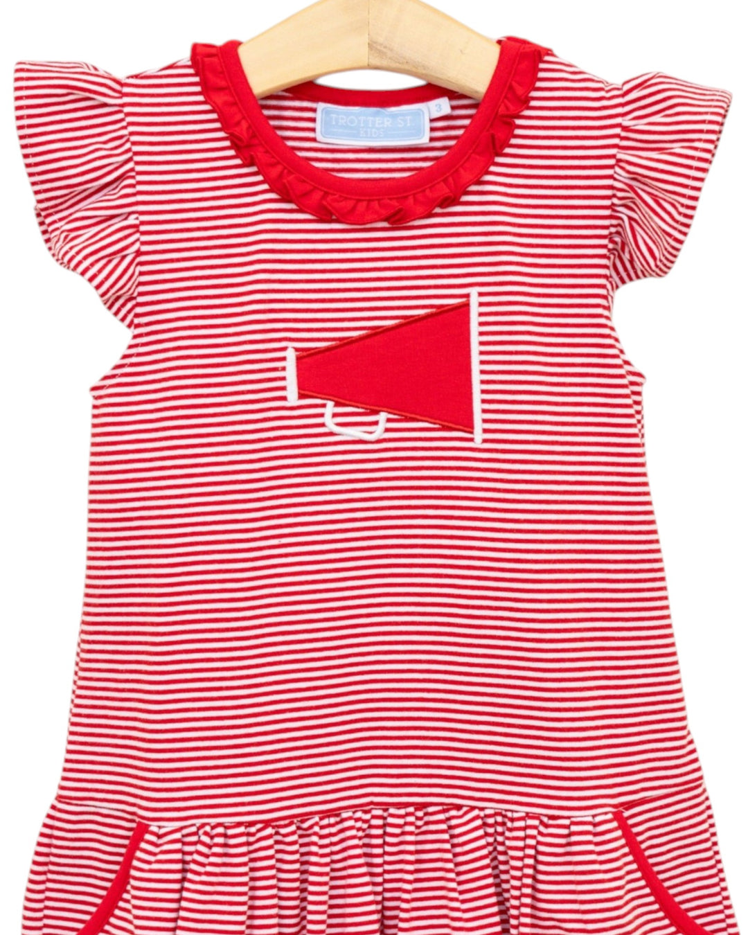 Red and white striped dress with a megaphone design on a hanger