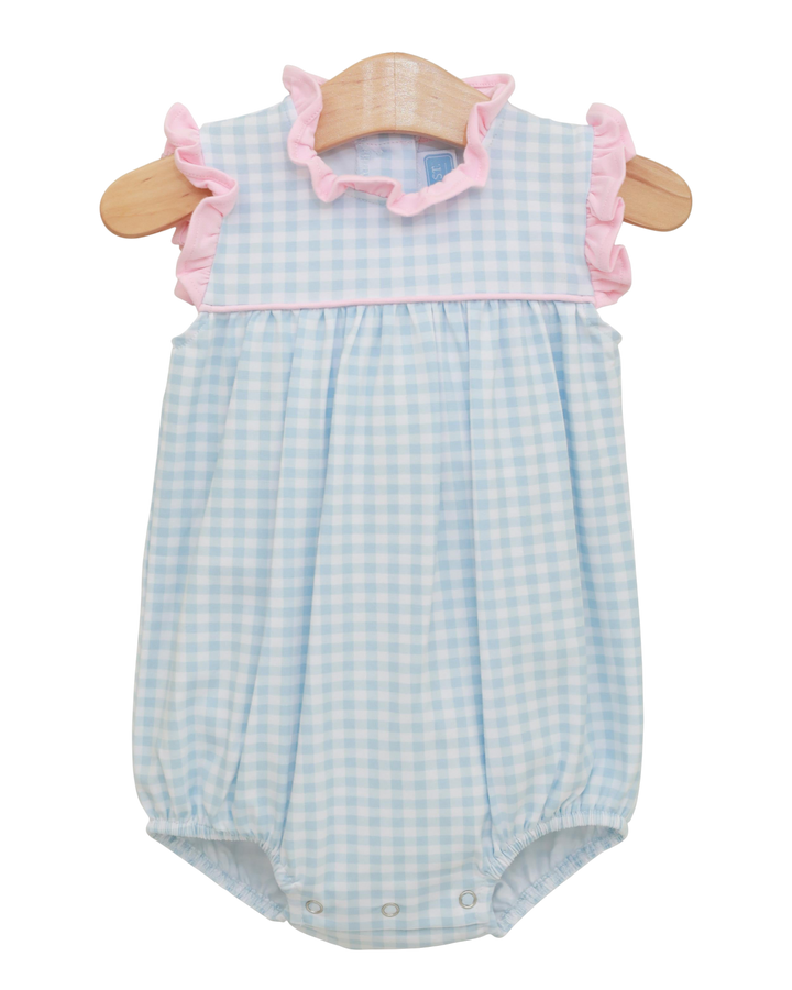 Baby romper with blue checkered pattern and pink ruffled details on a white background