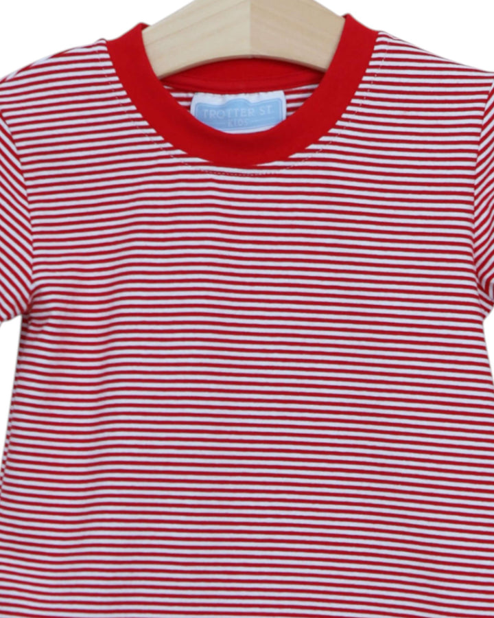 Red and white striped shirt on a hanger with a blue tag.