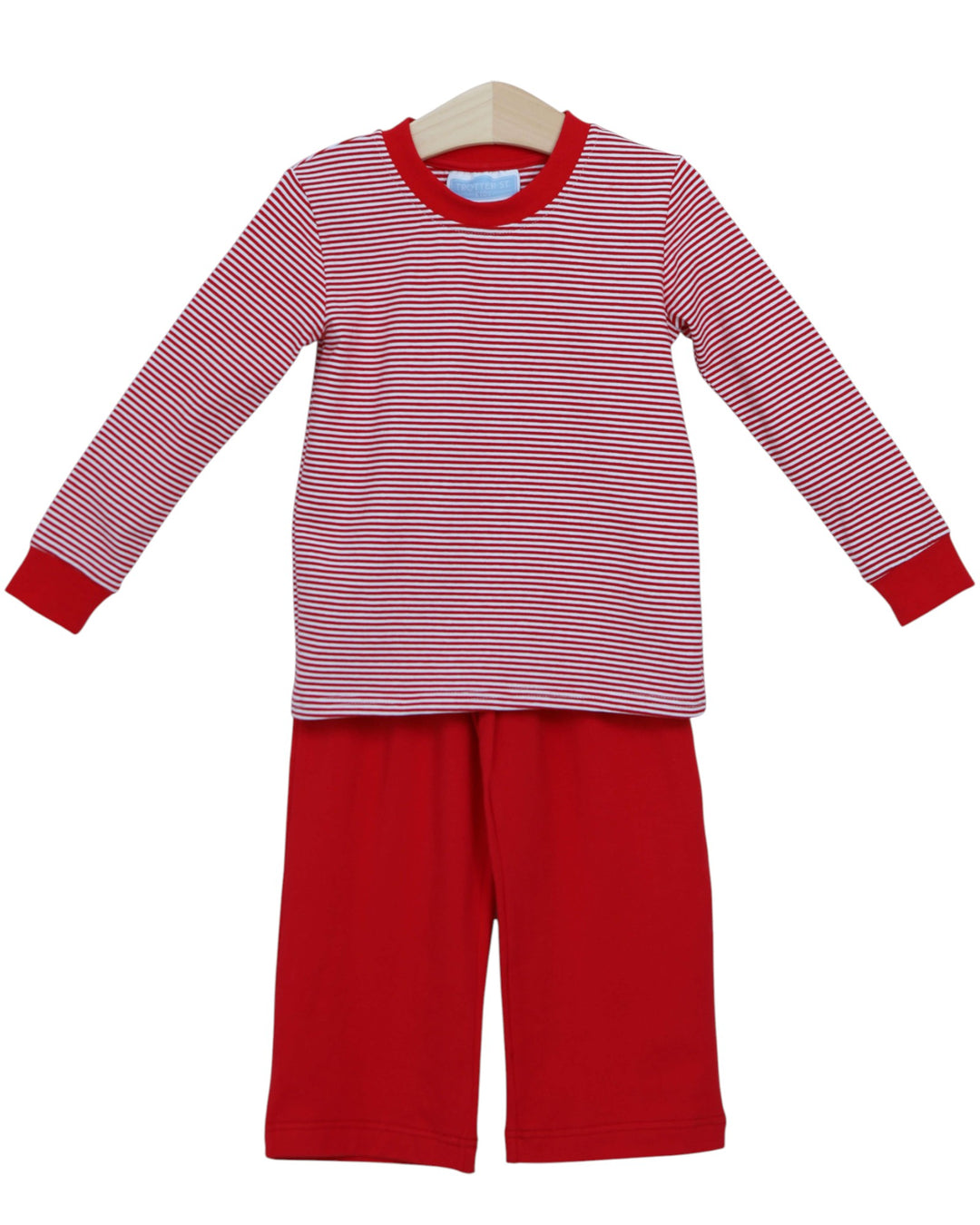 Red and white striped pajama set on a hanger against a white background