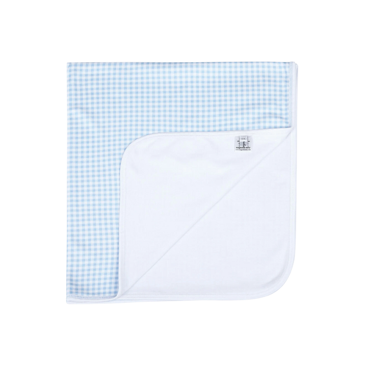 White baby blanket with blue checkered pattern on a white background