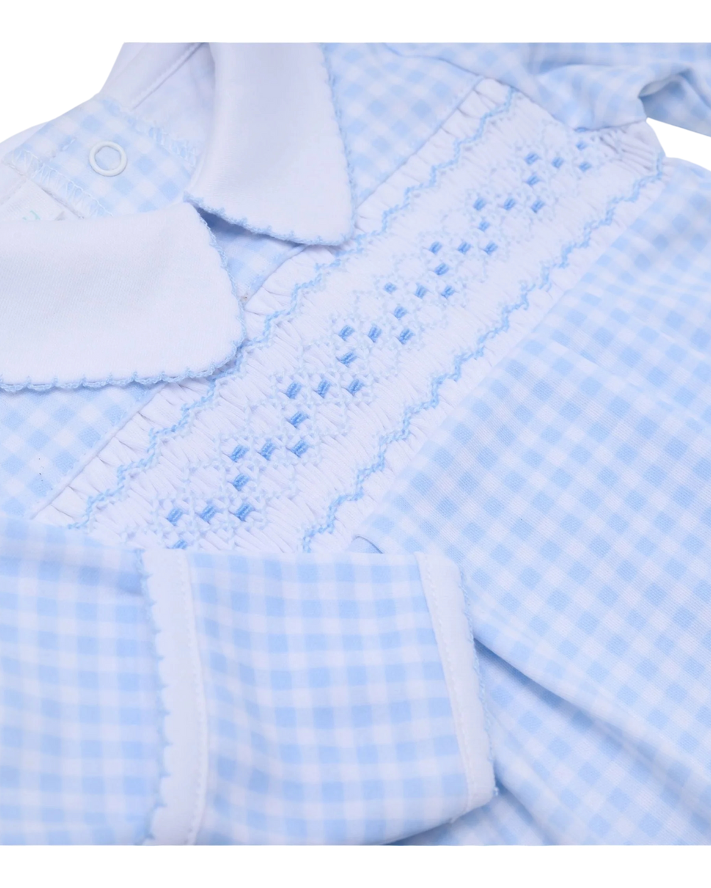 Close-up of a baby outfit with blue checkered pattern