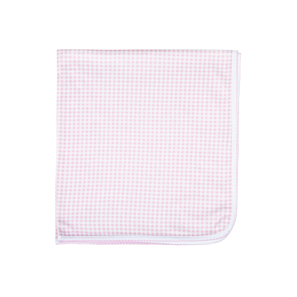Pink and white checkered fabric on a white background