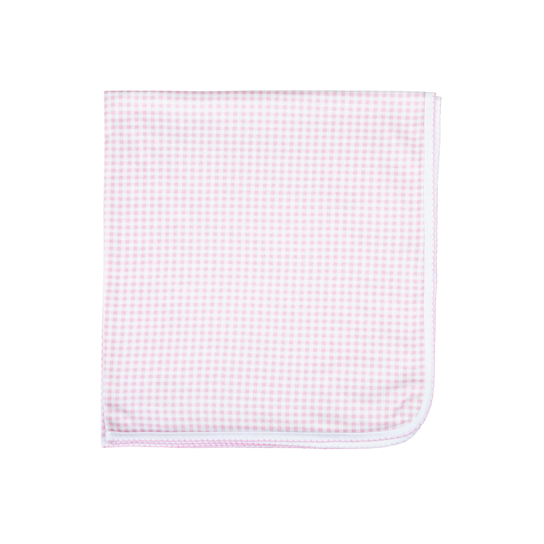 Pink and white checkered fabric on a white background