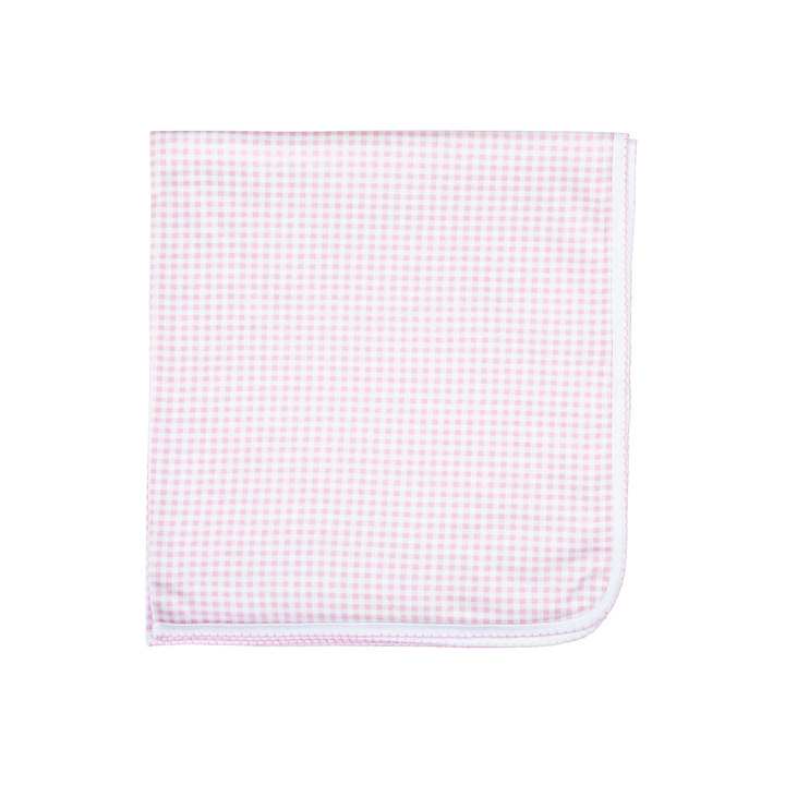 Pink and white checkered fabric on a white background