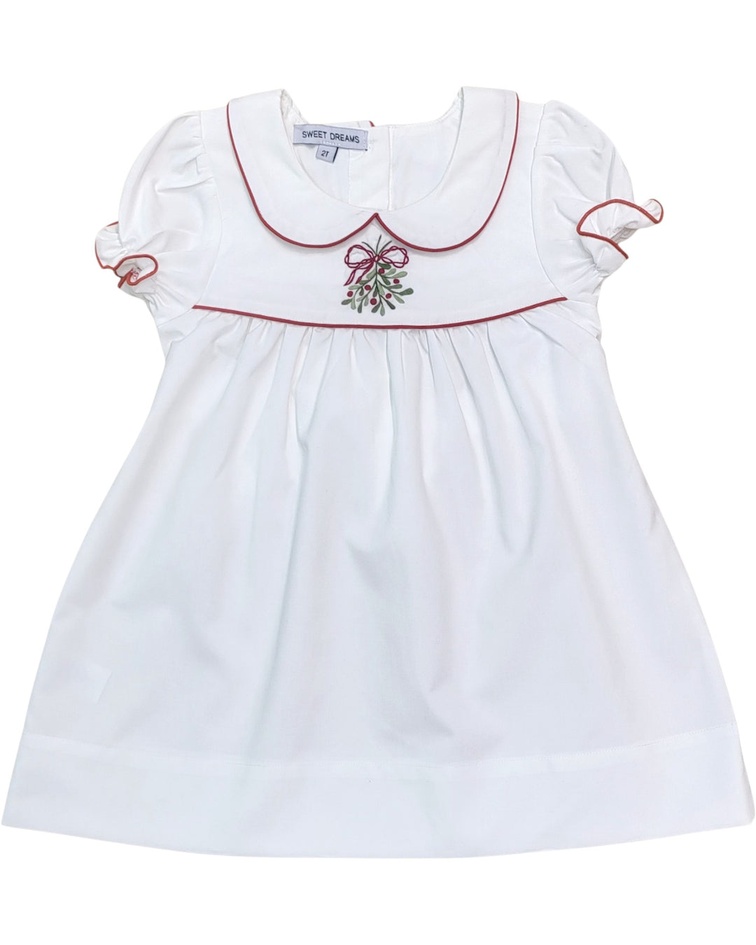 White dress with red trim and embroidered design on a white background