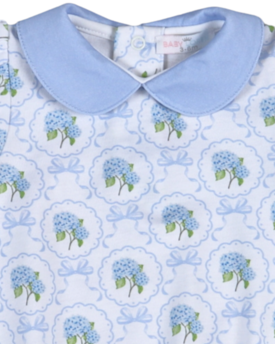Children's dress with blue floral pattern and light blue collar