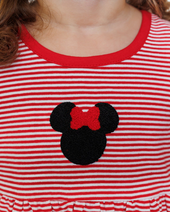Red and white striped shirt with a black and red mouse head design on a child's chest.