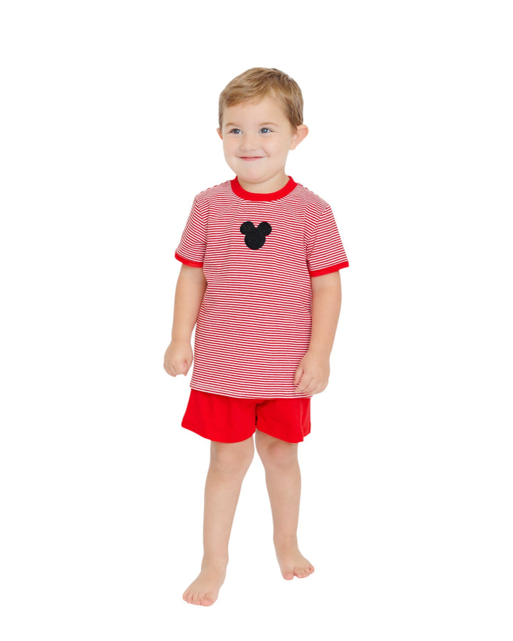 Child wearing a red and white striped shirt with a black mouse head design and red shorts on a white background