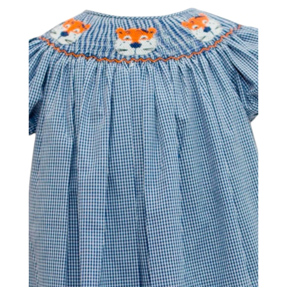 That Store navy and white gingham smock dress featuring hand-embroidered orange tiger faces on the neckline.
