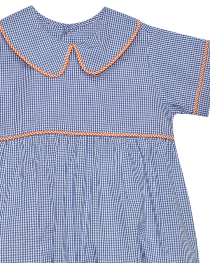 Blue checkered dress with orange trim on a white background