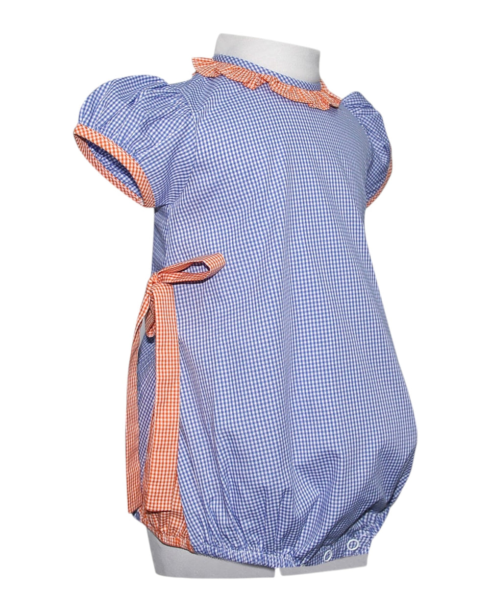 Blue checkered baby romper with orange trim on a white background