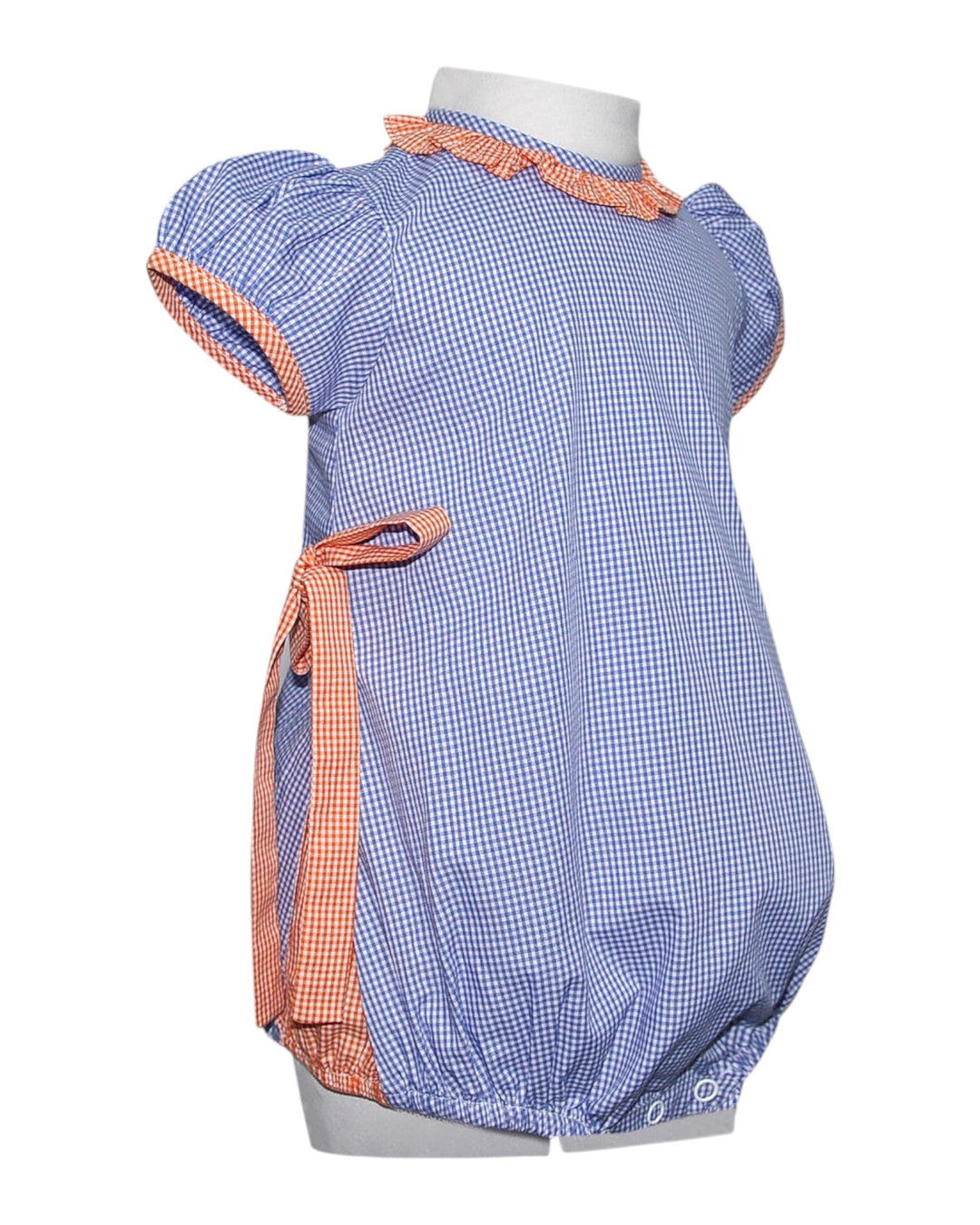 Blue checkered baby romper with orange trim on a white background
