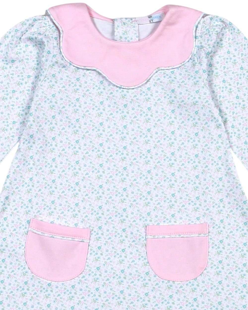 Baby dress with floral pattern and pink accents on a light blue background
