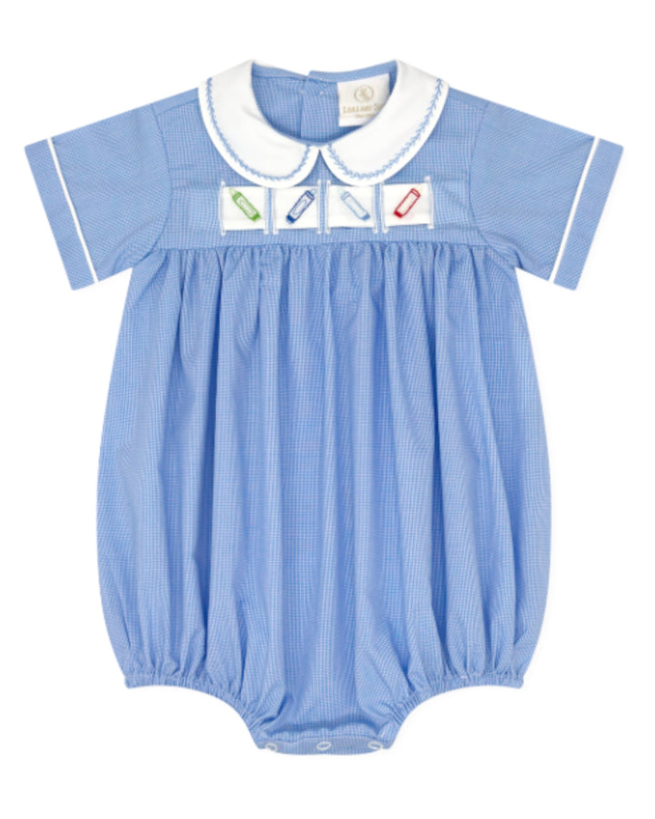 A baby short-sleeve bubble romper in light blue and white pinstripe fabric, featuring a white Peter Pan collar with blue trim and a decorative band of four small colorful enamel pin slots across the chest that store