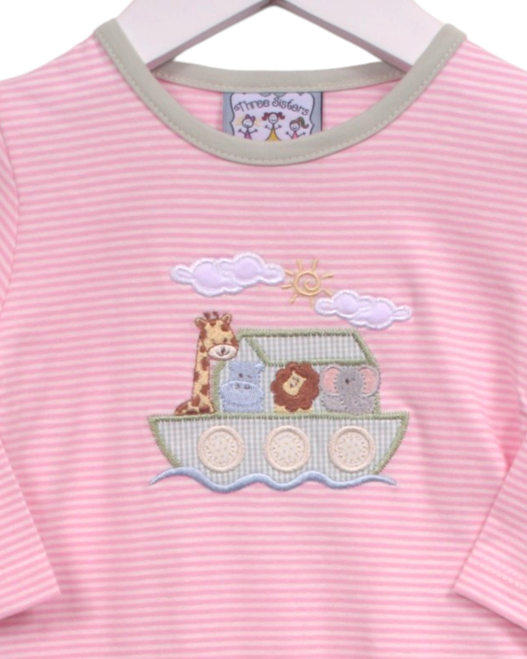 Pink and white striped long-sleeve baby t-shirt with a green collar, featuring an embroidered Noah&