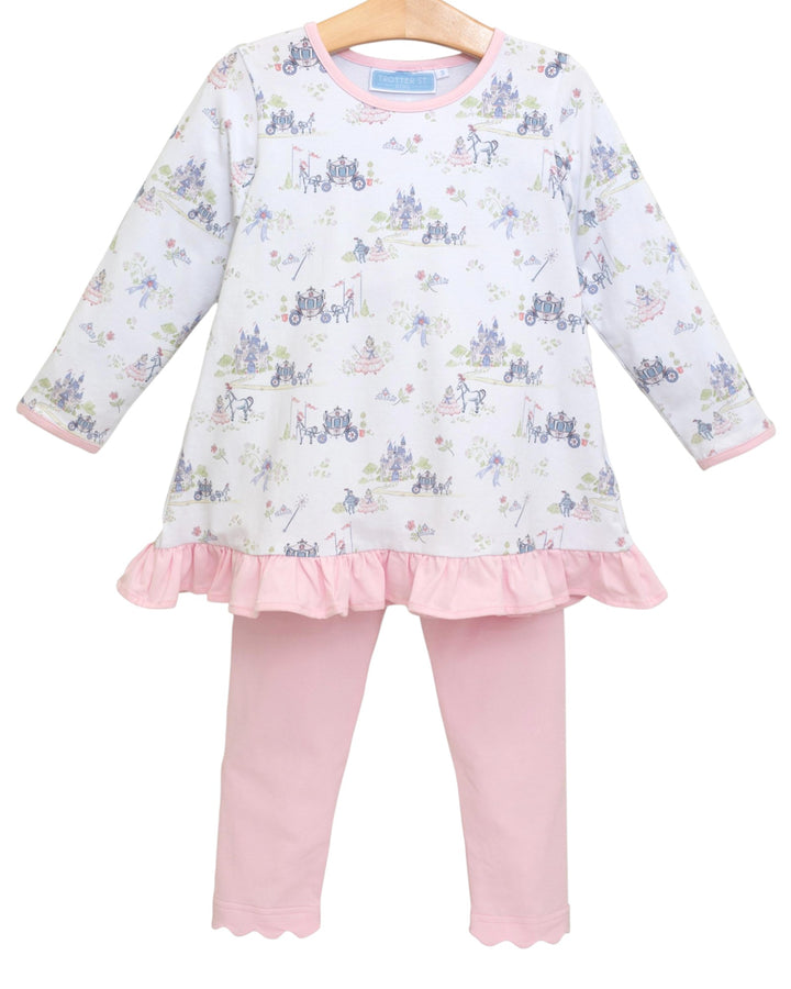 Children's outfit with floral top and pink pants on a white background