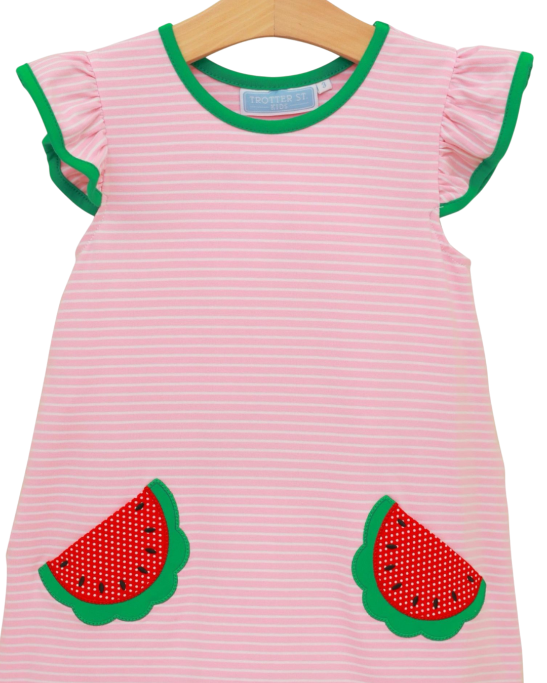 Light blue children's t-shirt with a pocket and matching shorts on a hanger against a white background