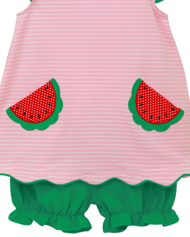 Pink and green dress with watermelon designs on a white background