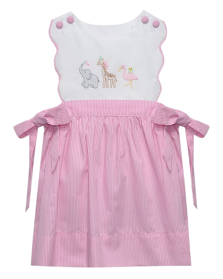 Pink and white dress with embroidered animals on a white background, that store