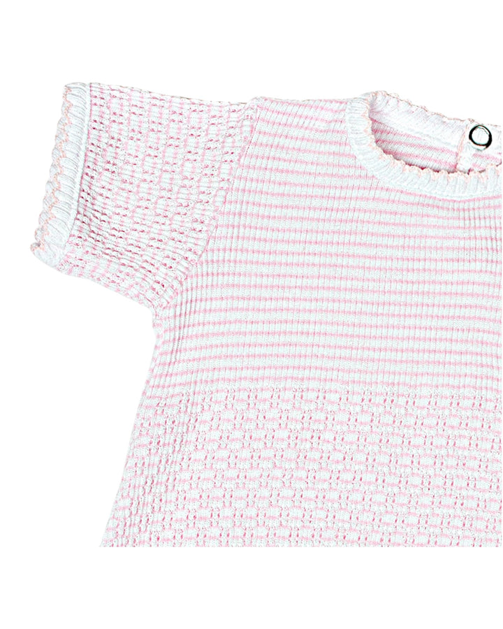 Pink and white textured top on a white background