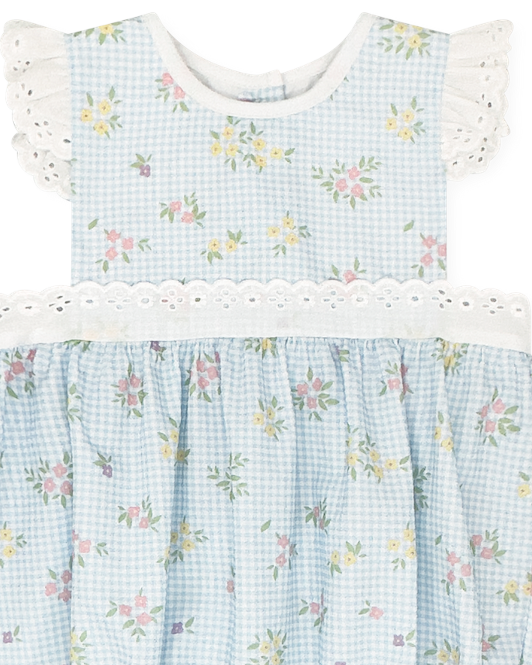 Baby dress with floral pattern and white ruffled collar on a light blue checkered background