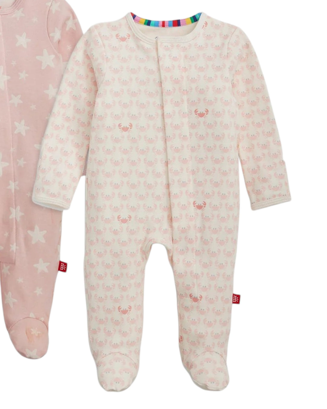 Two baby onesies on a white background, one pink with star pattern and the other white with deer pattern.