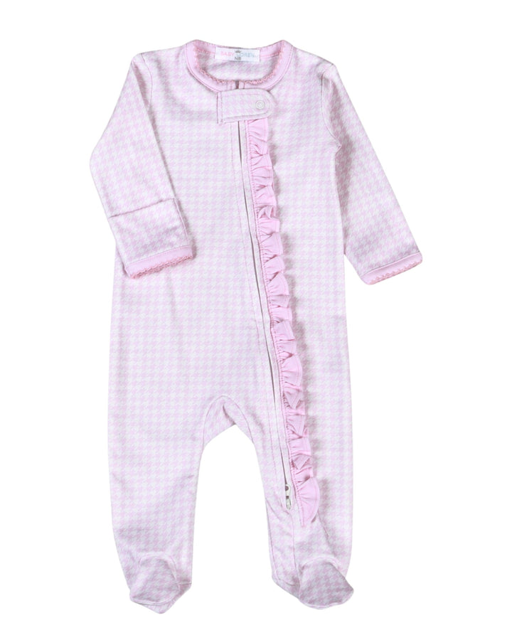 A baby footed sleeper in a light pink and white gingham check pattern, featuring a decorative pink ruffle trim down the center front zipper, that store