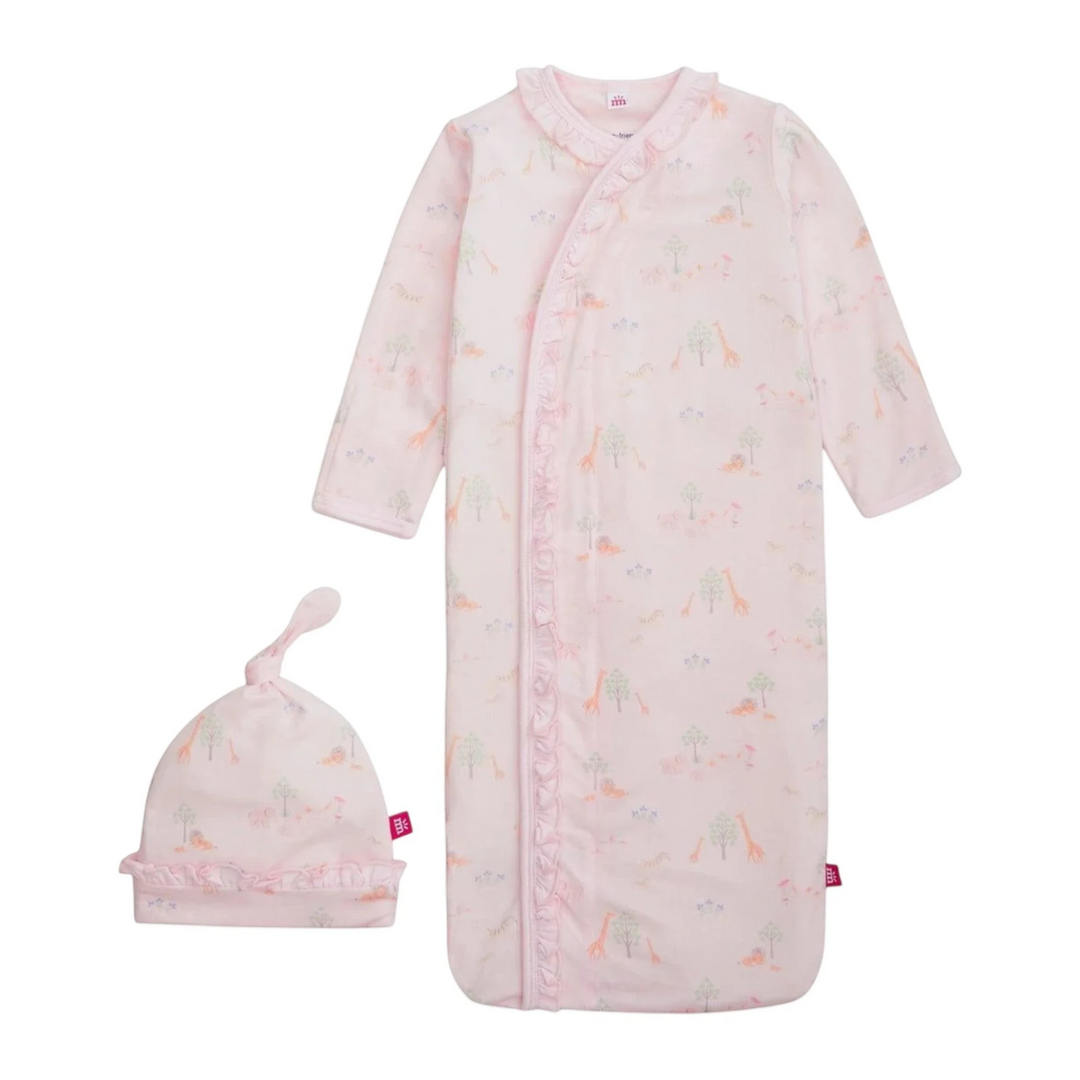 Baby pink sleeper with dinosaur pattern and matching hat on a white background