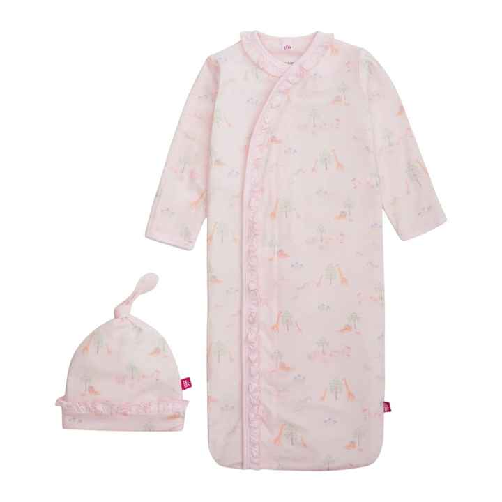 Baby pink sleeper with dinosaur pattern and matching hat on a white background