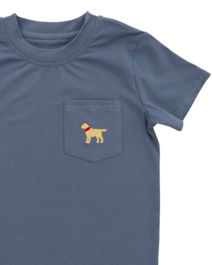 Blue t-shirt with a dog illustration on the pocket against a white background