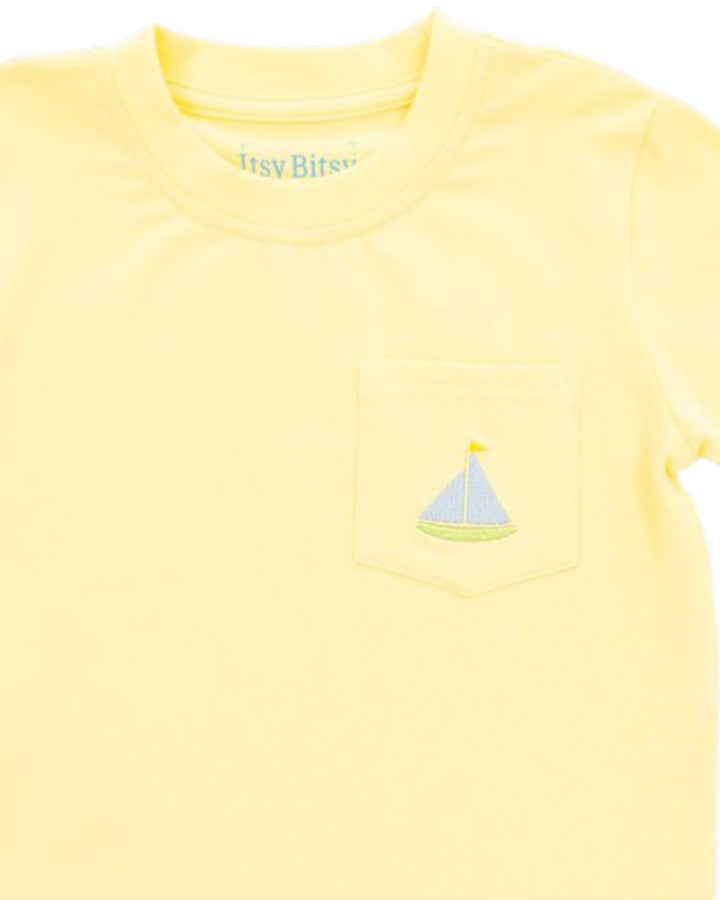 Yellow t-shirt with a sailboat design and 'Irby Birt' text on a white background
