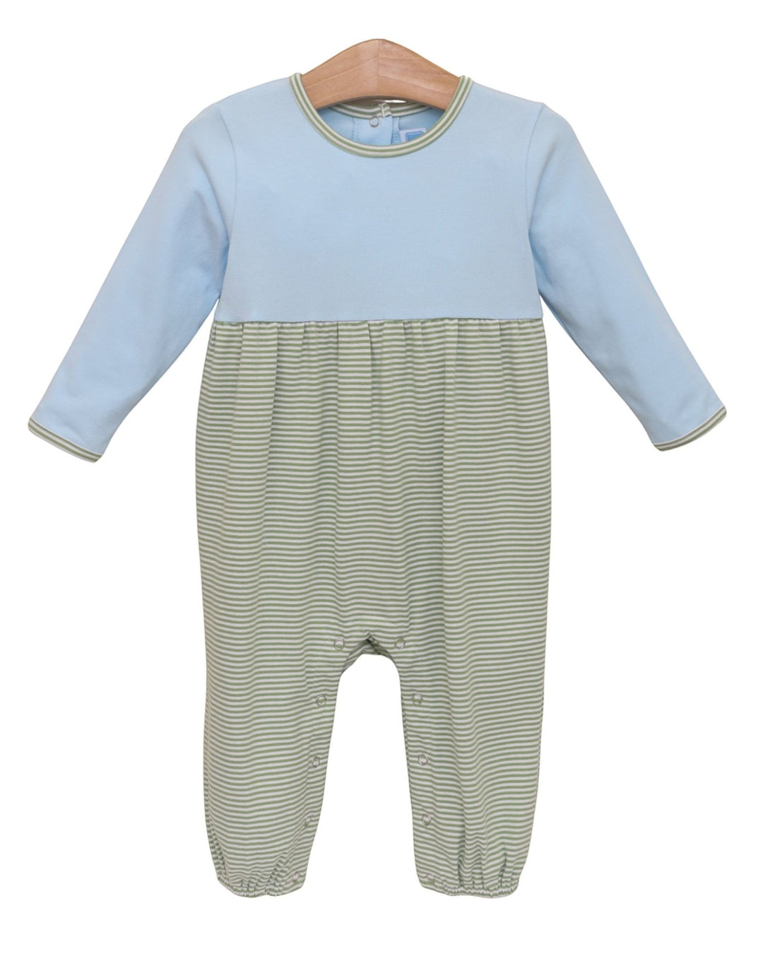 A baby long-sleeve footless romper with a light blue upper half and green-and-white striped lower half, hanging on a wooden hanger against a white background, that store