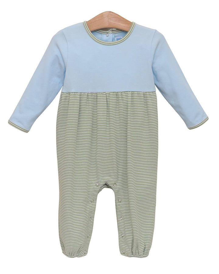 A baby long-sleeve footless romper with a light blue upper half and green-and-white striped lower half, hanging on a wooden hanger against a white background, that store