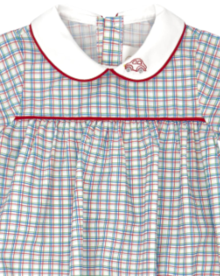 Plaid dress with a white collar and red trim on a white background