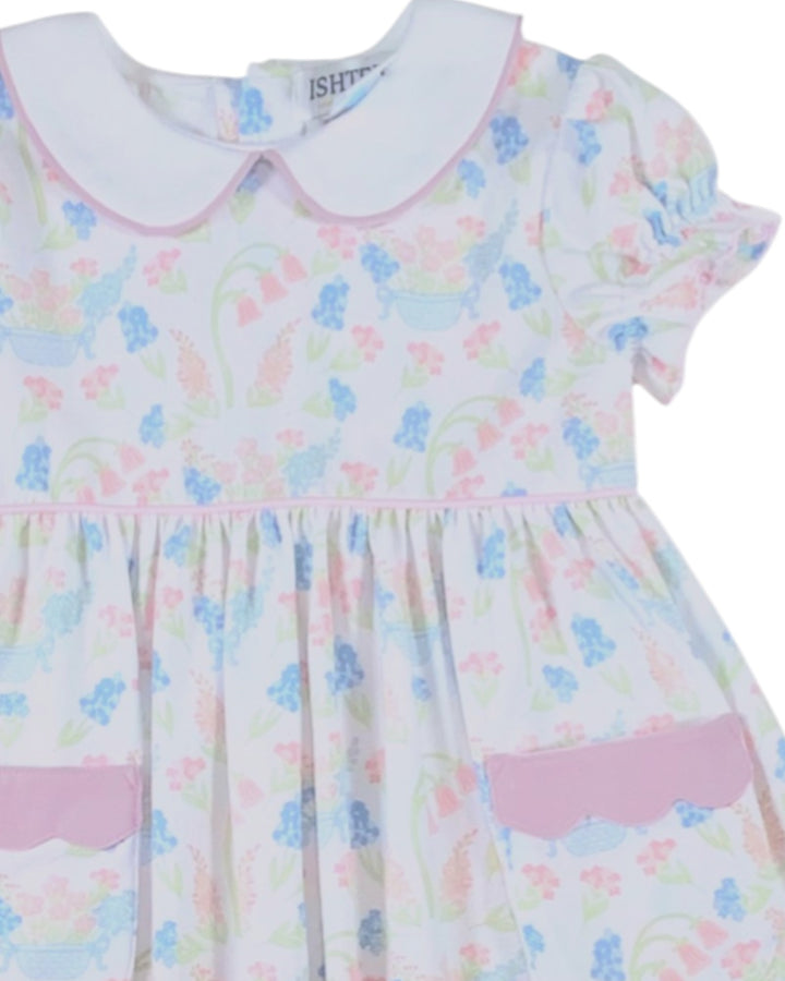 Pastel-colored dress with floral pattern on a white background