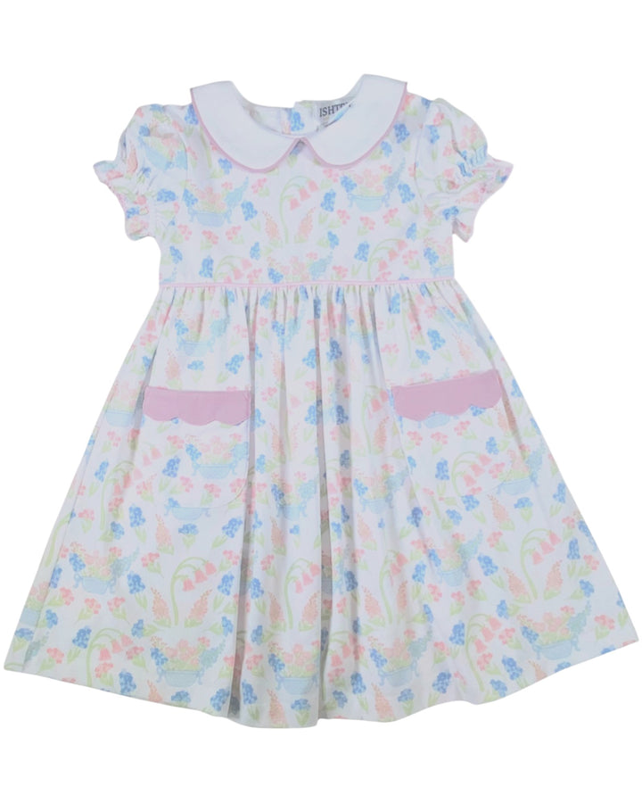 Pastel floral dress with a pink collar on a white background