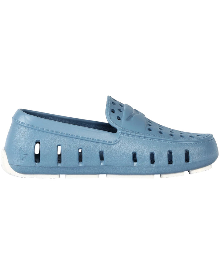 Blue loafer-style shoe on a white background