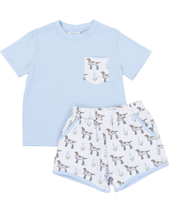 Light blue t-shirt with a pocket and patterned shorts on a white background