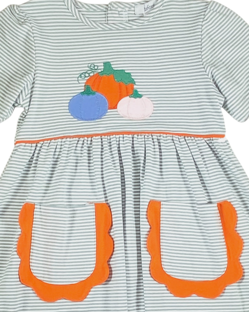 Striped dress with pumpkin appliqué and orange accents on a white background