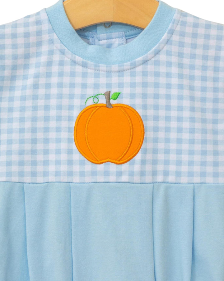 Light blue checkered dress with an orange pumpkin patch on a wooden hanger.