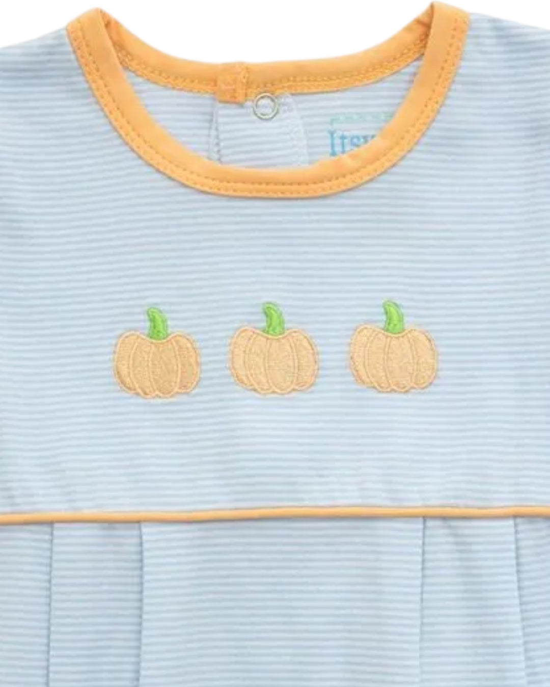 Close-up of a baby top with light blue and white horizontal stripes, featuring a mustard yellow crew neck trim and three embroidered orange pumpkins with green stems across the chest, that store