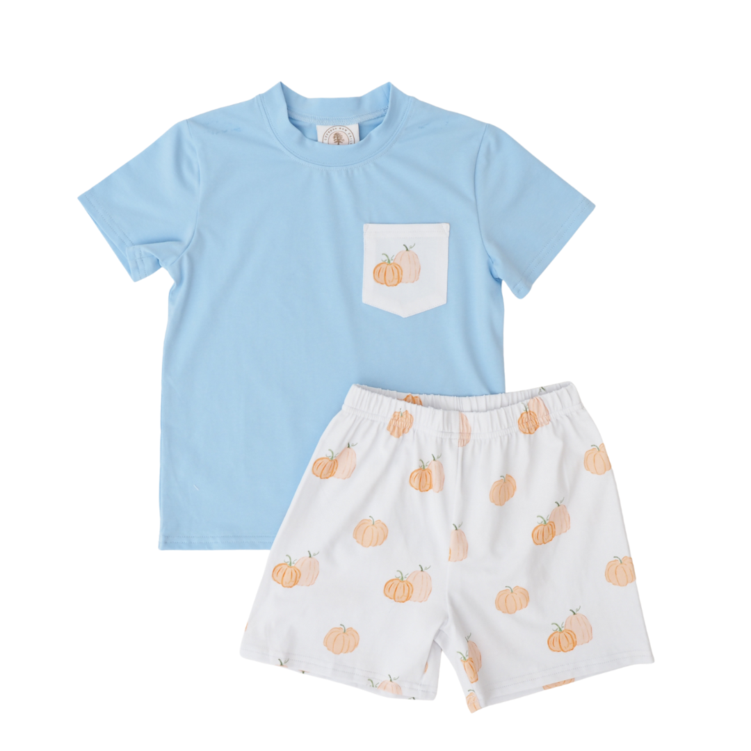 Children's outfit with blue shirt and white shorts featuring pumpkin pattern on a white background, that store